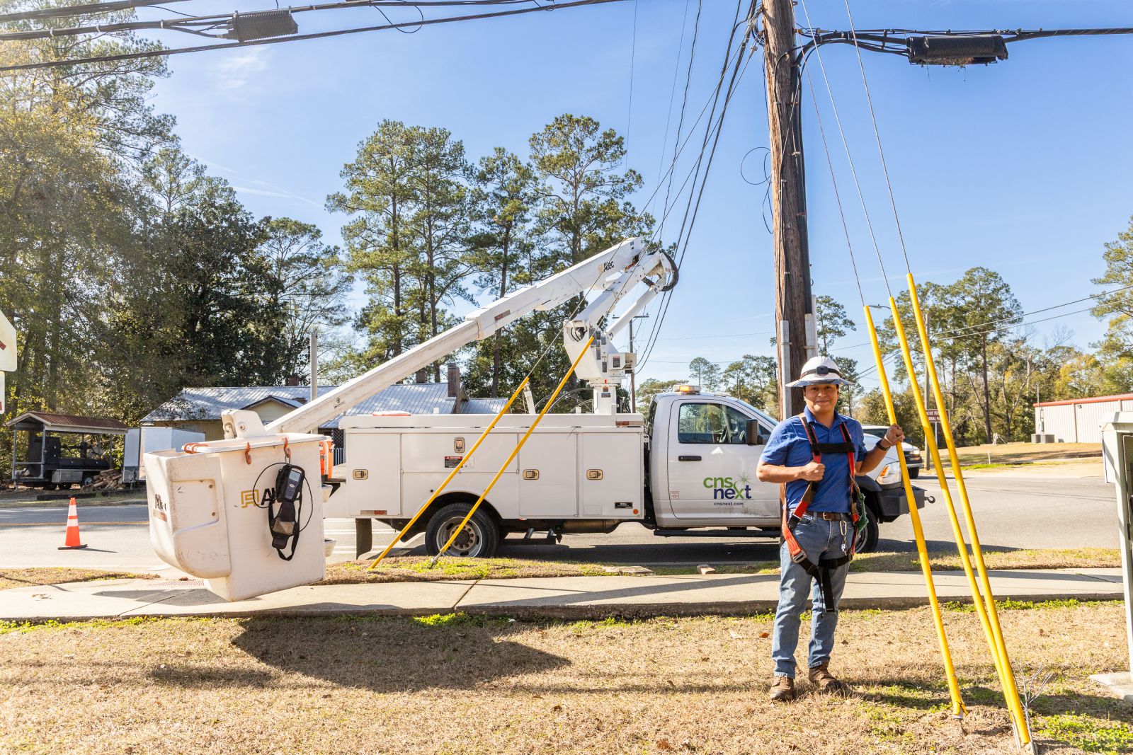 Worker in front of a utility truck